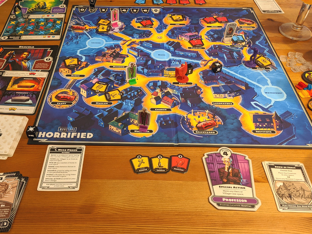 A spread of cooperative board games on a table