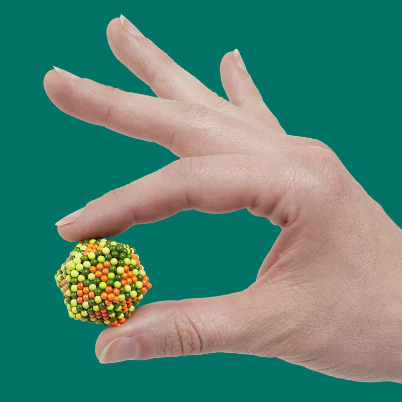 Speks magnetic beads being shaped and fidgeted with in hand