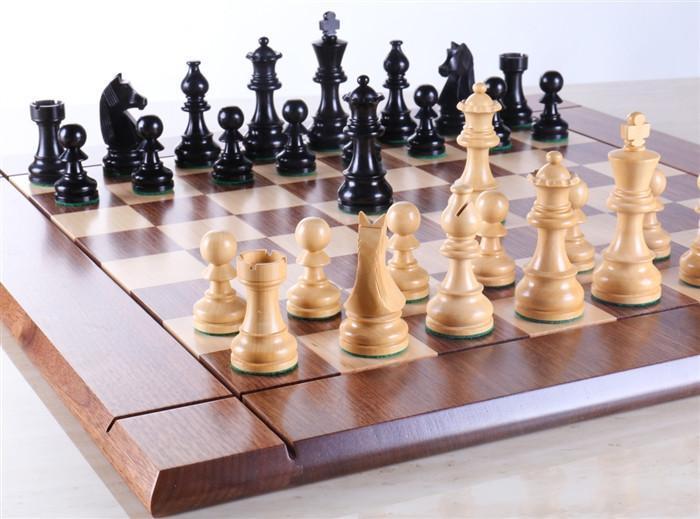 Ebonized & boxwood Staunton chessmen on a USA walnut/maple heirloom board