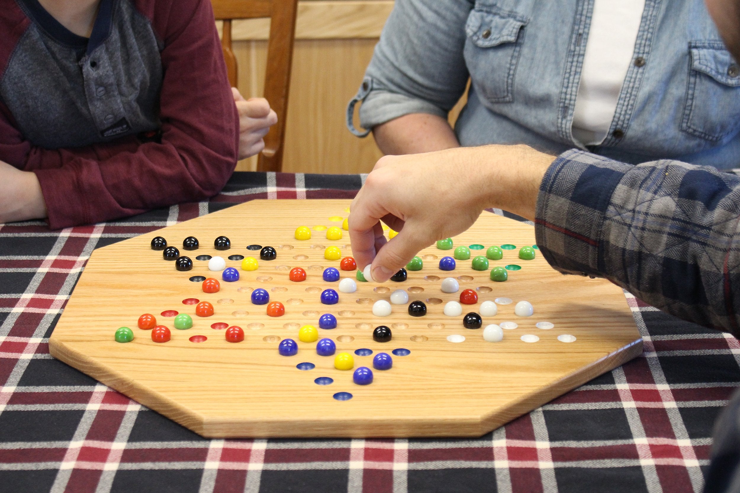 Hand-painted 19-inch solid-oak Chinese checkers board with glass marbles