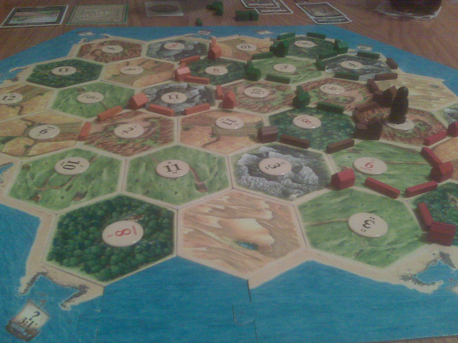 Settlements and cities planted on the board, each scoring resources from the three hexes it borders.