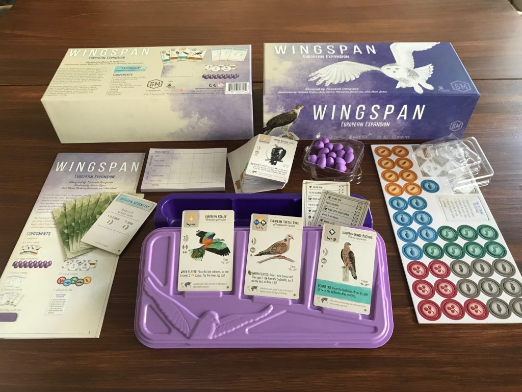 An overview of Wingspan's full component spread — boards, cards, dice tower, and tokens.